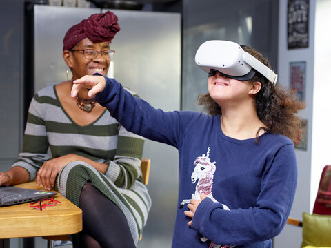 Mother and daughter with Down syndrome using virtual reality headset