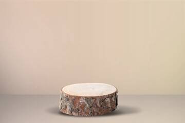 Round wooden saw cut cylinder shape on background. The scene with geometrical forms.