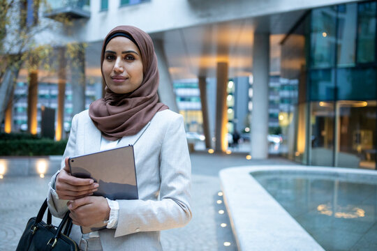 UK, London, Portrait of businesswoman in hijab in city
