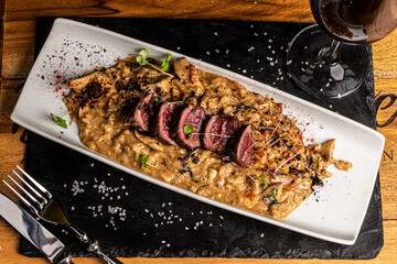 Beef tenderloin with gourmet risotto and wine