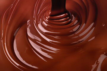 Obraz na płótnie Canvas melt dark chocolate background. pour liquid cocoa dessert