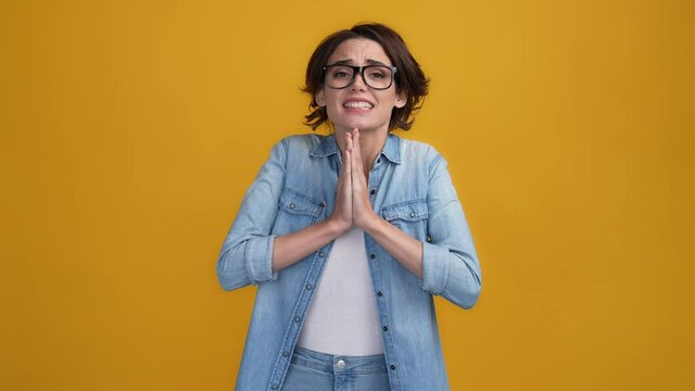 Nervous lady plead good marks test isolated bright color background