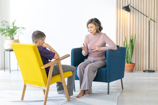 Woman Conducts An Explanatory Conversation With A Difficult Teenager. School Psychologist. Full-length Image.