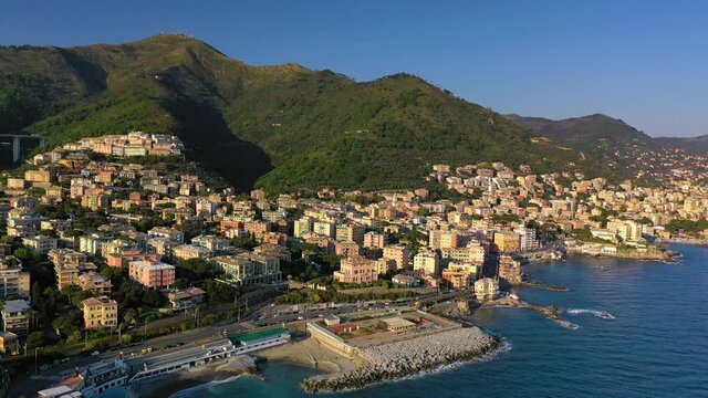Aerial view around villas on the coast of Genova quarto, golden hour in Italy - circling, drone shot