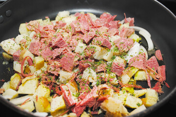 Corned Beef Hash Cooking in a Pan - obrazy, fototapety, plakaty