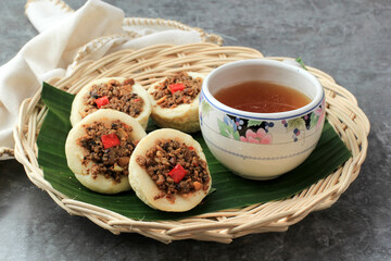 Kue Talam Oncom, Traditional Steamed Cup Cake from Indonesia with Oncom Topping.