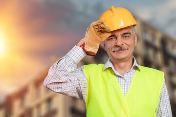 Male engineer handsome man or architect looking construction with safety helmet