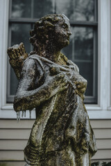 Frozen yard statue figure in front of a house