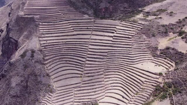 Agricultural Terraces of Pisac in The Ancient Inca Ruins In Southern Peru - aerial shot