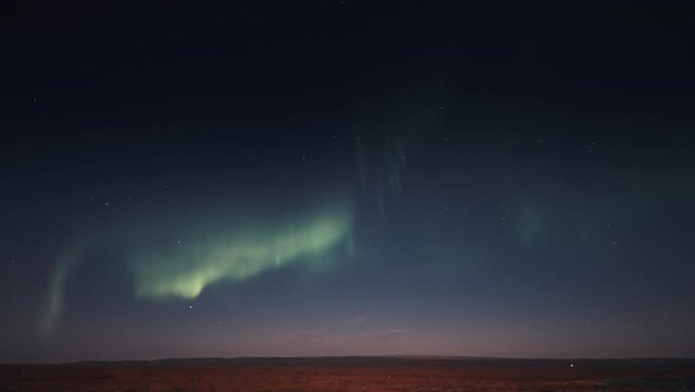 A timelapse of the beautiful dance of the pale and gentle lights of the aurora on the night sky.