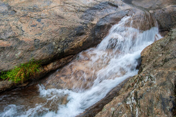 Rocks and waterfalls in misty mountains, Lushan, China