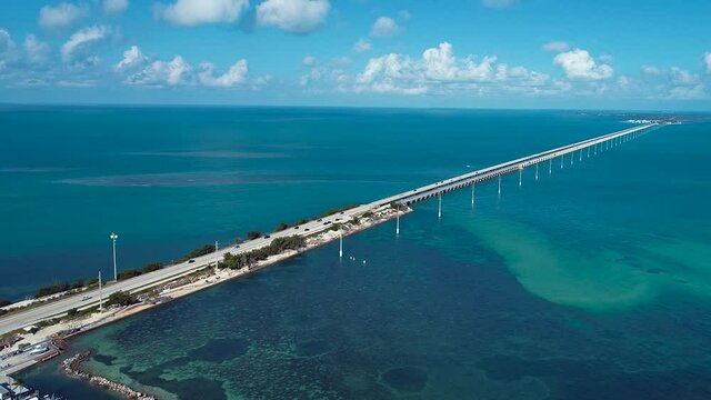 Panning wide of 7 Mile Bridge Florida Keys United States near Key West Florida Keys. Travel highway road. Freeway road. Coastal road.