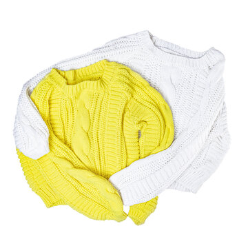 Embrace Of White And Yellow Sweaters Isolated On White Background. View From Above.
Cozy And Comfortable Sweater,knitted, Hand Knitted.
