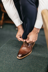 Man tying shoe
