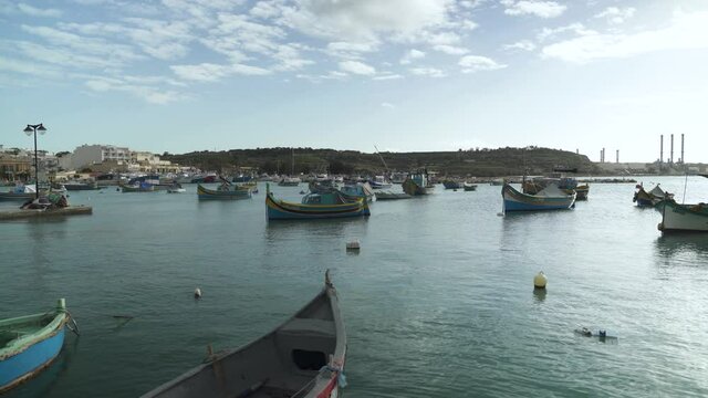 Marsaxlokk Bay with Traditional Fishing Boats Decorated with Osiris Eyes in the Harbour
