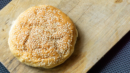 The homemade bread rolls with sesame seeds. Burger buns with sesame seeds, ingredients for hamburger.