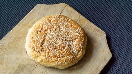 The homemade bread rolls with sesame seeds. Burger buns with sesame seeds, ingredients for hamburger.