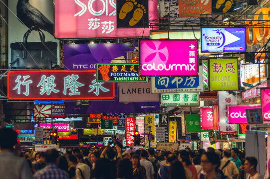 May 1, 2015: Colorful neon advertisement banners filled with the sky in the busy streets of Kowloon, hong kong, china at night. It is an iconic scenery in this city.