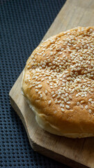 The homemade bread rolls with sesame seeds. Burger buns with sesame seeds, ingredients for hamburger.
