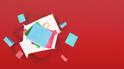 Empty shopping bag on red background, copy space text