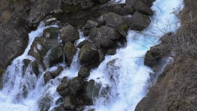 Stream from waterfall “Kegon falls”, close up. Beautiful landscape in Japan, autumn
