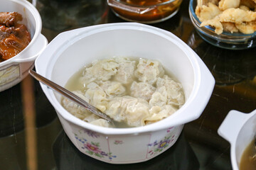 Traditional Chicken beef or shrimp Gyoza Soup in a bowl