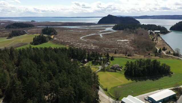 Cinematic pan shot of McGlinn Island, Skagit Valley, Shelter Bay, Swinomish Village, Swinomish Channel on a native American indian tribal reservation in Washington