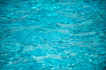 Abstract ripple wave and clear turquoise water surface in swimming pool, blue water wave for background and abstract design.