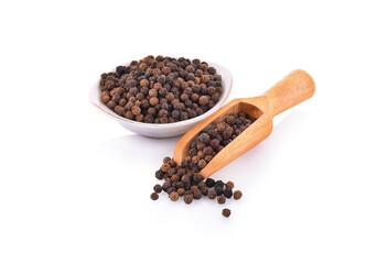 black pepper in a bowl isolated on white background