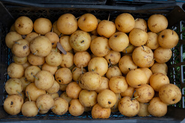 A box of fresh yellow apples.
