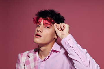 portrait of a young man pink shirt and glasses jacket fashion elegant style isolated background unaltered