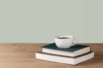Home office workspace with coffee cup, and book