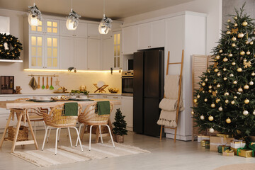 Cozy open plan kitchen decorated for Christmas. Interior design