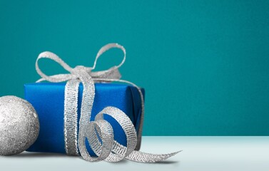 Christmas greeting card composition. Craft paper gift with ribbon