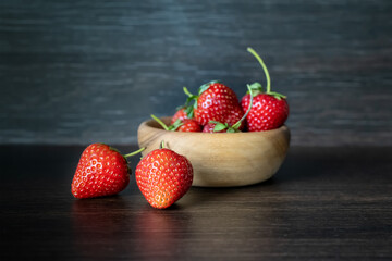 Still life with fresh strawberries on a dark background