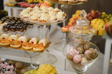 various dessert with fresh fruit on buffet line, sweet