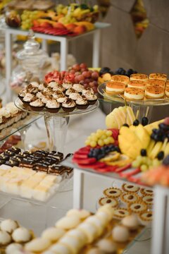 various dessert with fresh fruit on buffet line, sweet