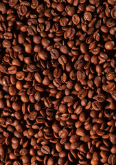 Roasted coffee beans texture. Close up view with a lot of coffee, image that can be used as background.