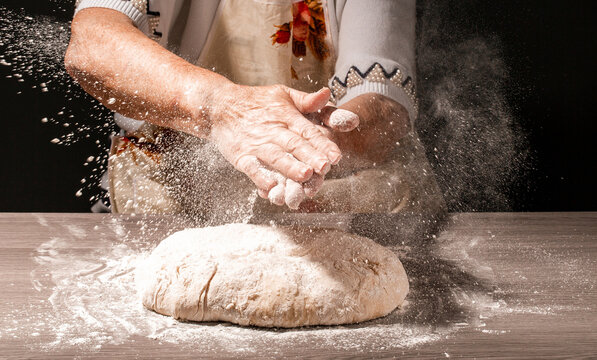 Hands Of Granny Kneads Dough. 80 Years Old Woman Hands Kneading Dough. Homemade Baking. Pastry And Cookery