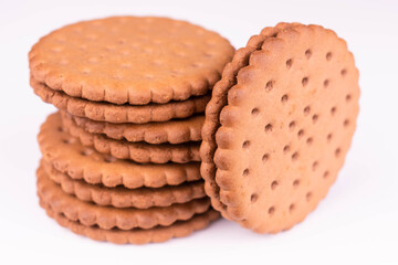 Chocolate chip cookies with filling on white background.