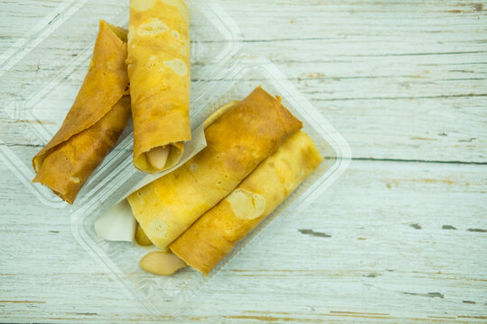 Thai Dessert Mini Pancake Rolls With Egg. Popular Street Snack In Thailand Called 