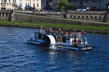Vistula river and touristic ferry boat, Wisla, Krakow Poland