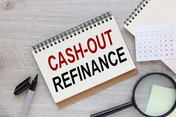 Cash out refinance open notepad on wooden office desk background and magnifier calendar pen