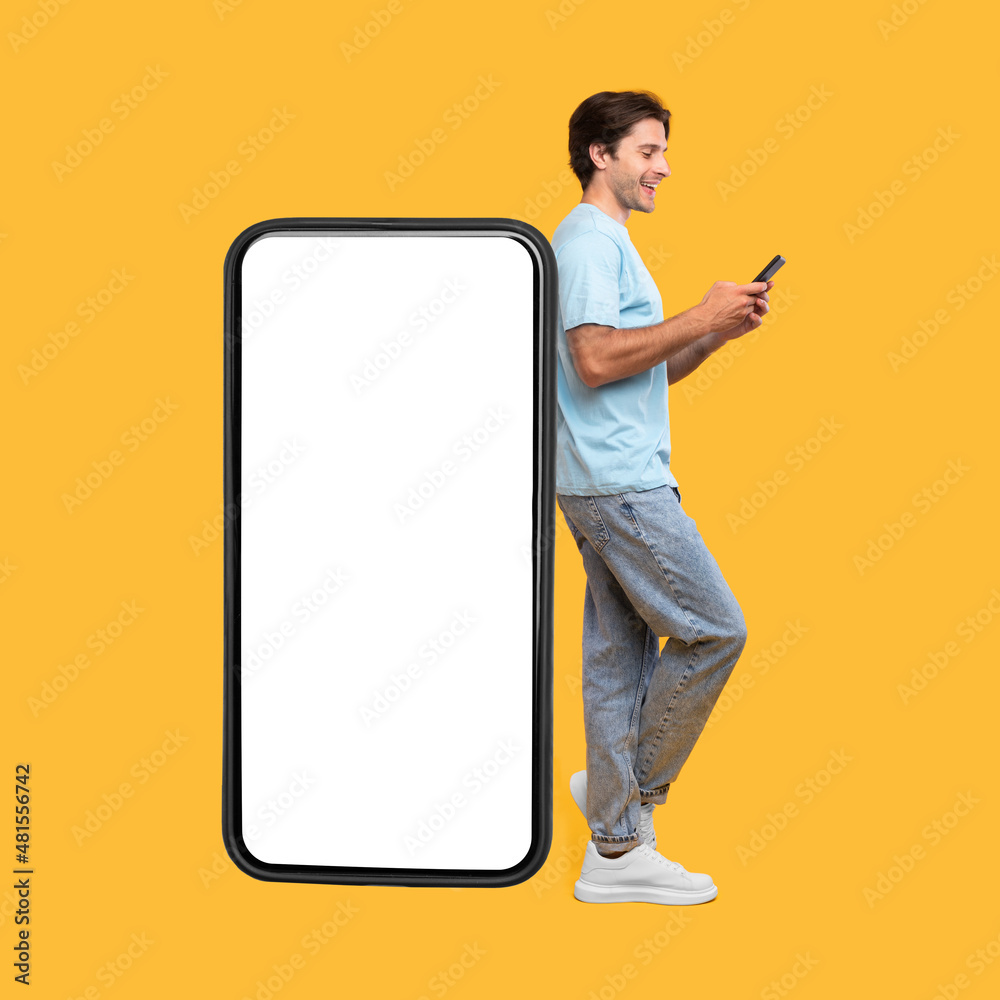 Poster Man leaning on white empty smartphone screen and using phone