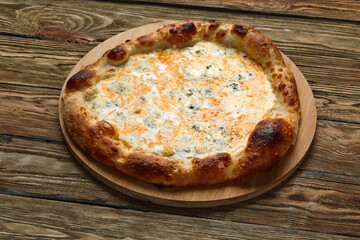 Italian Pizza Quattro formaggi. Italian pizza on dark stone background