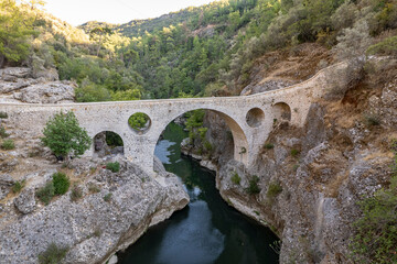 Fototapeta na wymiar Ali Brige. Gundogmus, Antalya. Very beautiful stone bridge. Beautiful port of the silk road