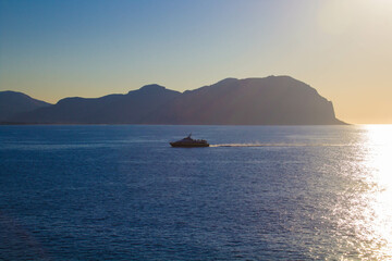 evocative image of sea coast with promontory on the background in Sicily, Italy