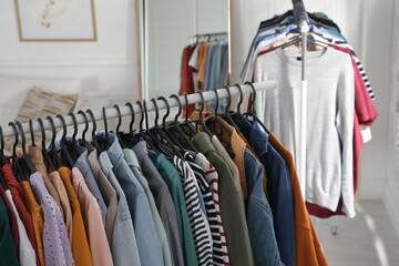 Obraz premium Racks with stylish clothes indoors. Fast fashion