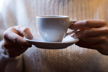 person holding a cup of coffee