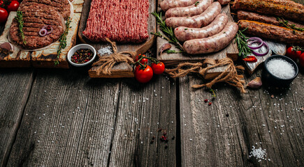Various kinds of grill and bbq raw meats. Chicken, steak, sausages, minced beef meat kebabs, pork...